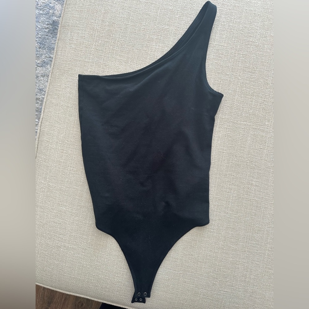 One sleeved body suit